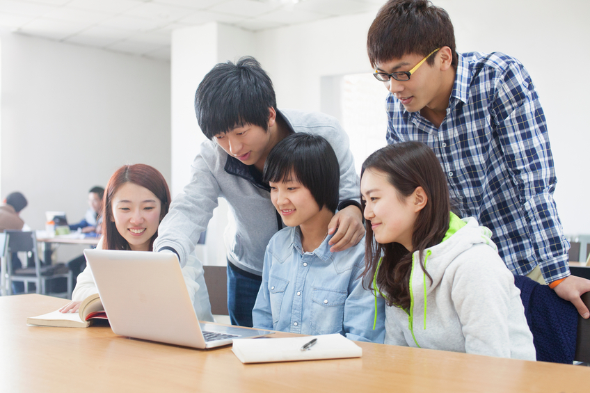 A group of students together to discuss learning